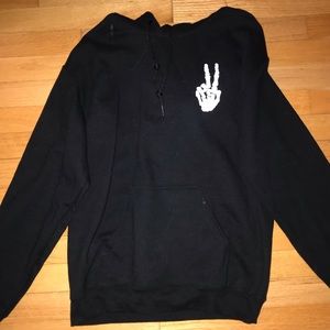 Plain black hoodie with “peace sign” skeleton logo